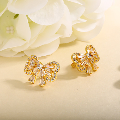 Brass hollow bow with inlaid zircon earrings