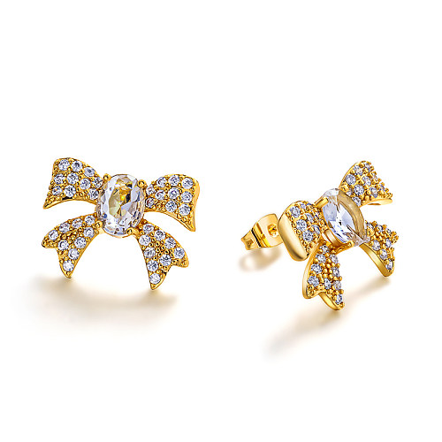 Brass bow with zircon earrings embedded