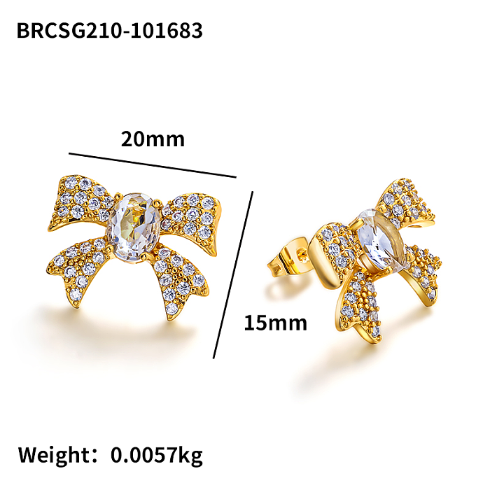 Brass bow with zircon earrings embedded