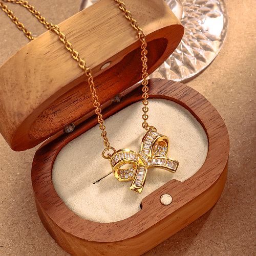 Brass three-dimensional bow inlaid with zircon 45+5cm necklace