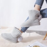 New sheepskin fur integrated snow boots for women's shoes with a fox hair ball pendant in the middle tube, warm wool short boots