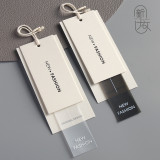 Clothing hang tags made of black soft adhesive thick cardboard logo, clothing trademark hanging, men's and women's clothing hang tags in stock