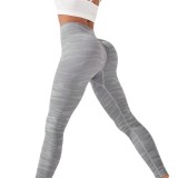 Hot selling seamless knitted high waisted waist tightening and hip lifting yoga pants from Europe and America for sports, fitness, breathability, moisture absorption, and sweat wicking leggings
