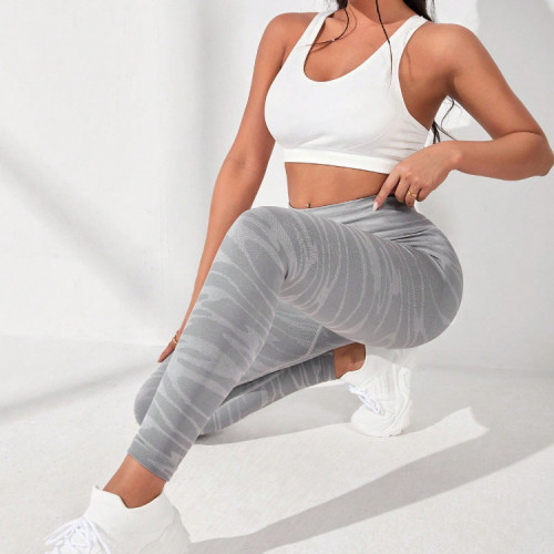 Hot selling seamless knitted high waisted waist tightening and hip lifting yoga pants from Europe and America for sports, fitness, breathability, moisture absorption, and sweat wicking leggings