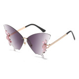 New butterfly shaped diamond inlaid frameless sunglasses for women, fashionable and personalized, exaggerated sunglasses for women with round faces and large faces