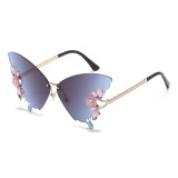 New butterfly shaped diamond inlaid frameless sunglasses for women, fashionable and personalized, exaggerated sunglasses for women with round faces and large faces