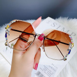Cross border new fashionable large frame diamond inlaid frameless cut edge sunglasses for women UV resistant sunglasses in stock at the factory