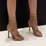Amazon's new black and gold 11cm slim heel small round head wrapped rhinestone pendant high heeled sandals summer heels