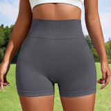 Seamless knitted yoga shorts from Europe and America, peach lifting buttocks, high waist fitness pants, tight fitting running sports, three part women's shorts
