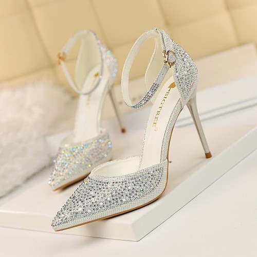 Korean version of sweet high heels, slim heels, high heels, shallow mouth, pointed, hollowed out one line with shiny rhinestone women's sandals