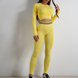Customized European and American seamless yoga suit set, long sleeved top with exposed navel jacket, tight pants, sports and fitness for women