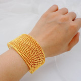Gold plated zinc alloy large bracelet with hollow carving
