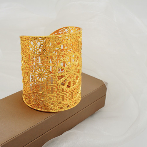 Gold plated zinc alloy large bracelet with hollow carving
