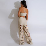 Two piece sexy suspender top paired with hollowed out wide leg pants for women