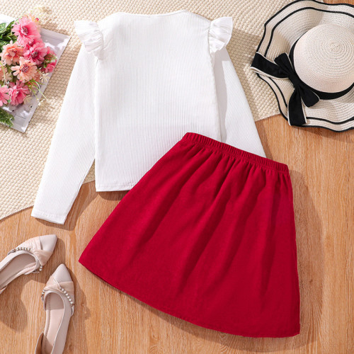 Fashion suit with large bow, half skirt, long sleeved top
