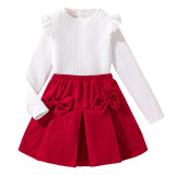 Fashion suit with large bow, half skirt, long sleeved top