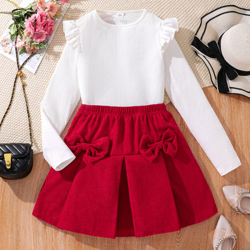 Fashion suit with large bow, half skirt, long sleeved top