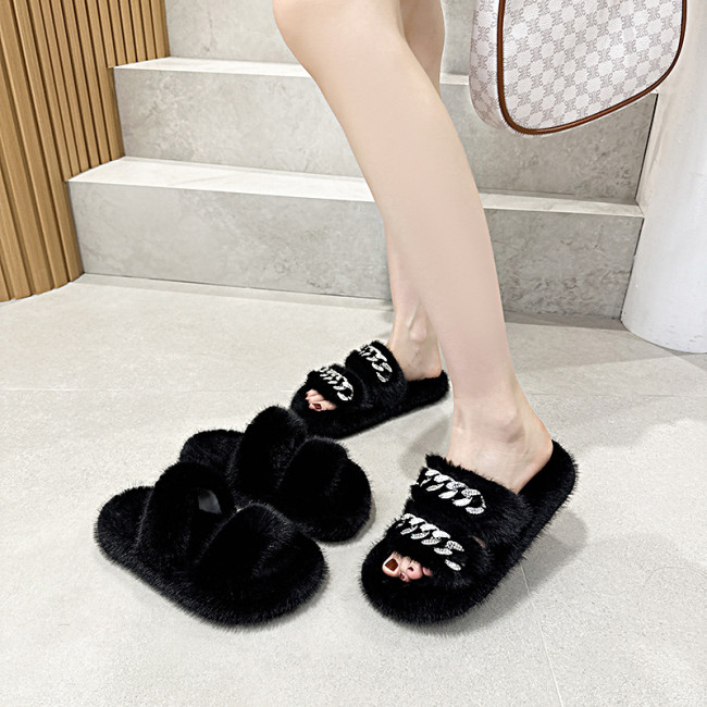 Wearing thick soled mink fur slippers on top of fur shoes for home use