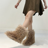 Winter snow boots with long fur and a midsole resembling raccoon fur