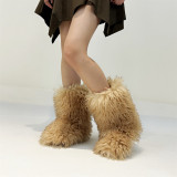 Winter snow boots with long fur and a midsole resembling raccoon fur