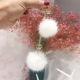 Mink fur ball smiley face ornament