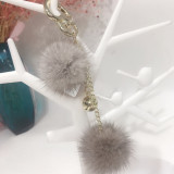 Mink fur ball smiley face ornament