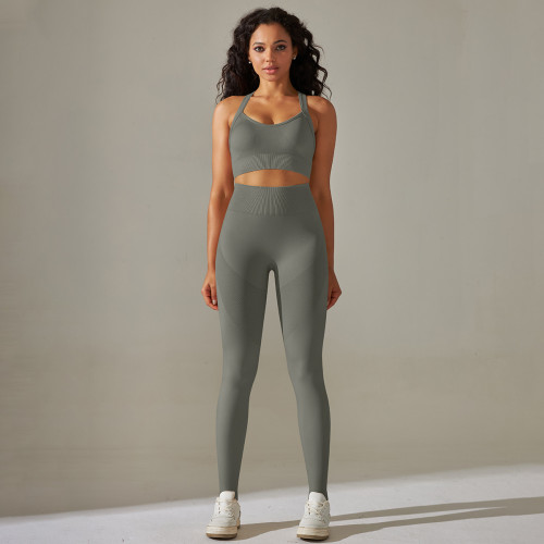 Cross-border European and American seamless knit solid color cross-back tight yoga outfit set with sports running fitness cropped pants