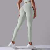Cross-border European and American seamless knitted solid color high-waisted tight peach-butt-lifting yoga pants for sports, running, and fitness, nine-point length