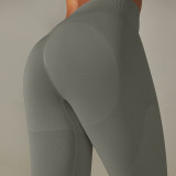Cross-border European and American seamless knitted high-waisted butt-lifting peach-colored solid color yoga pants for sports, running, and fitness