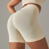 Cross-border seamless tight-fitting solid color peach butt-lifting high-waisted shapewear yoga shorts for women, suitable for sports, running, and fitness