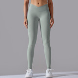 Cross-border European and American seamless knitted breathable solid color cross-waist peach butt yoga pants, running fitness cropped pants for women
