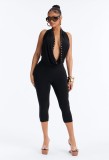 Cross-border European and American summer new foreign trade sexy hot girl rivet halter neck deep V-neck backless three-quarter jumpsuit