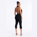Cross-border European and American summer new foreign trade sexy hot girl rivet halter neck deep V-neck backless three-quarter jumpsuit
