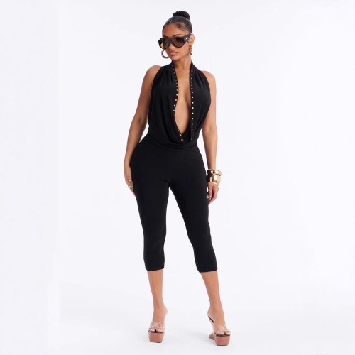 Cross-border European and American summer new foreign trade sexy hot girl rivet halter neck deep V-neck backless three-quarter jumpsuit