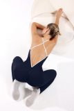 Xiyin's popular deep V-neck one-piece yoga outfit for women, featuring contrasting color straps, cross-back design, and peach butt-enhancing effect, suitable for fitness