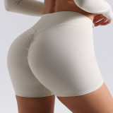 European and American style seamless peach butt yoga shorts for women, suitable for running and fitness, high-waisted, tummy-controlling, slimming, with no awkward lines, three-quarter length shorts