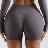 European and American style seamless peach butt yoga shorts for women, suitable for running and fitness, high-waisted, tummy-controlling, slimming, with no awkward lines, three-quarter length shorts