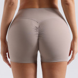 European and American style seamless peach butt yoga shorts for women, suitable for running and fitness, high-waisted, tummy-controlling, slimming, with no awkward lines, three-quarter length shorts