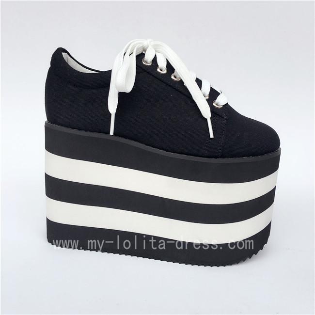 black canvas shoes with white laces