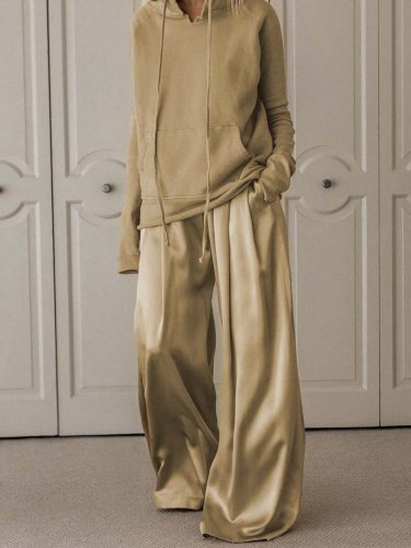 Two-piece suit of solid color hooded sweater and trousers