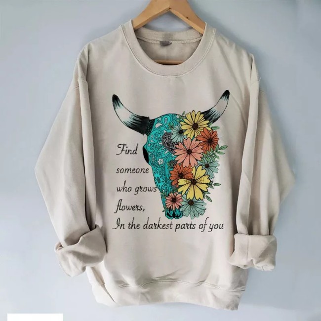 Find someone who grows flowers in the darkest parts of you Sweatshirt