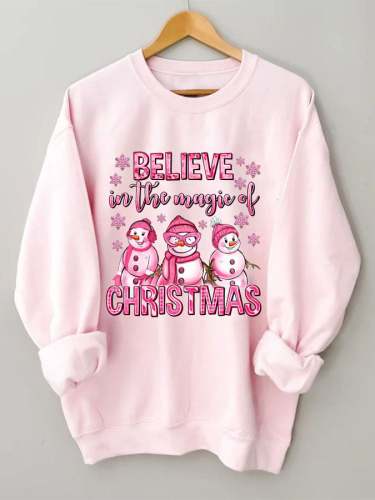Women's Believe In The Magic Of Christmas pink snowman print sweatshirt