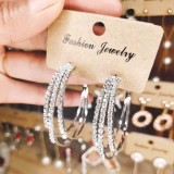 Hoop earrings with shiny diamonds, a pair