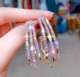 Hoop earrings with shiny diamonds, a pair