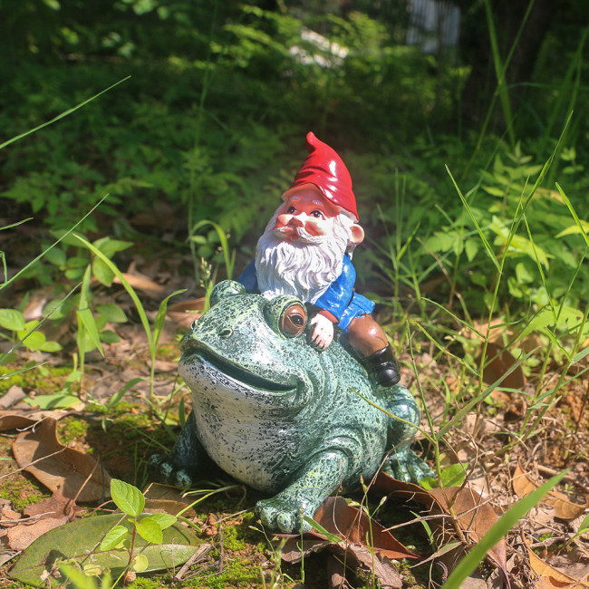 Gnome Sitting on Frog Statue