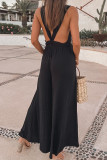 Sleeveless V-Neck Backless Flared Pants Jumpsuit Unishe Wholesale