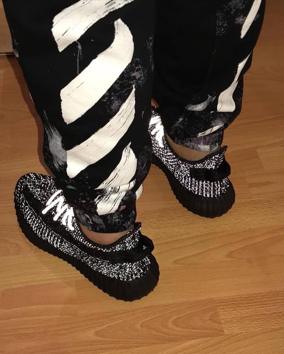 yeezy 350 v2 black reflective on feet