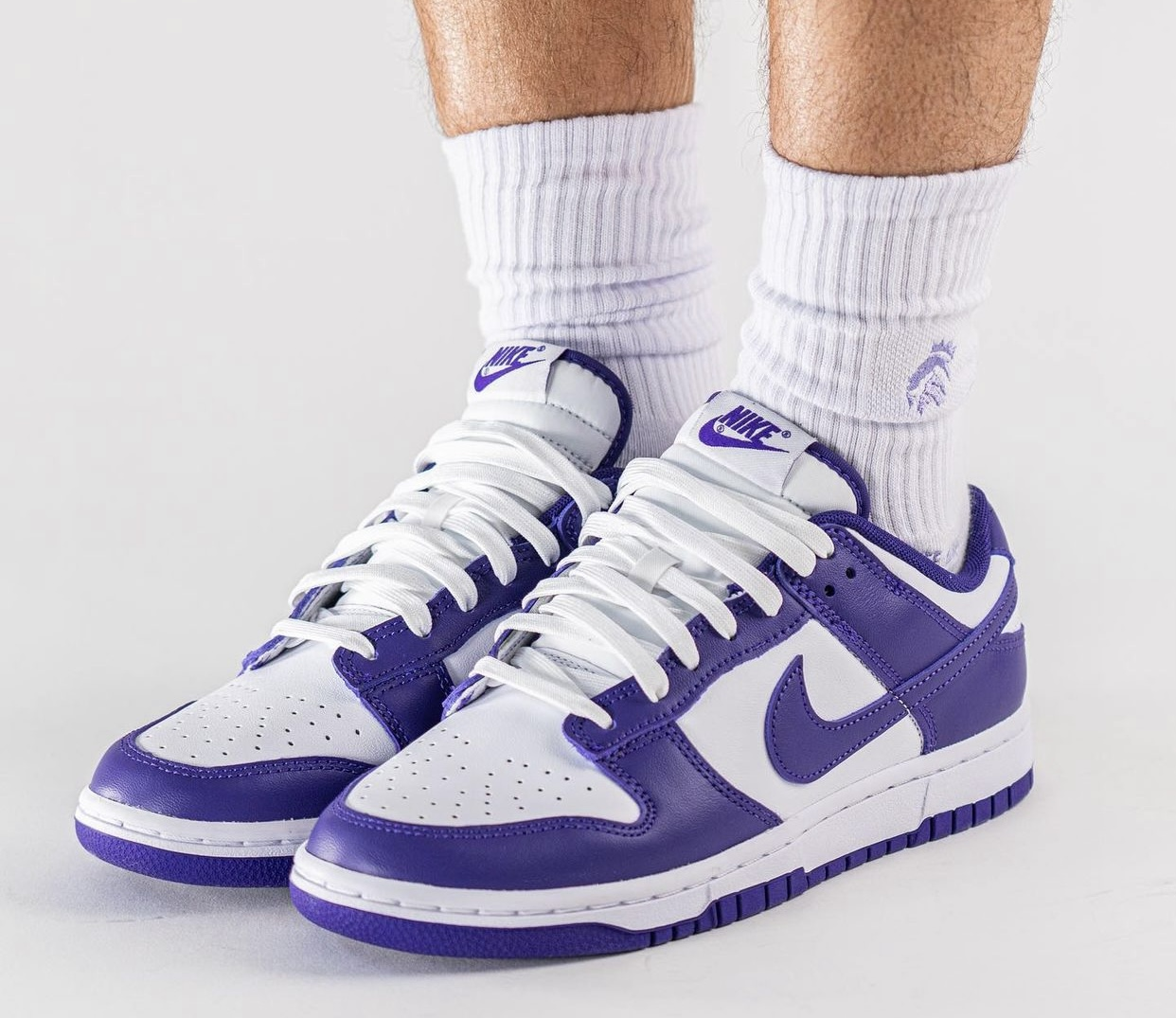 purple and white nike dunk low