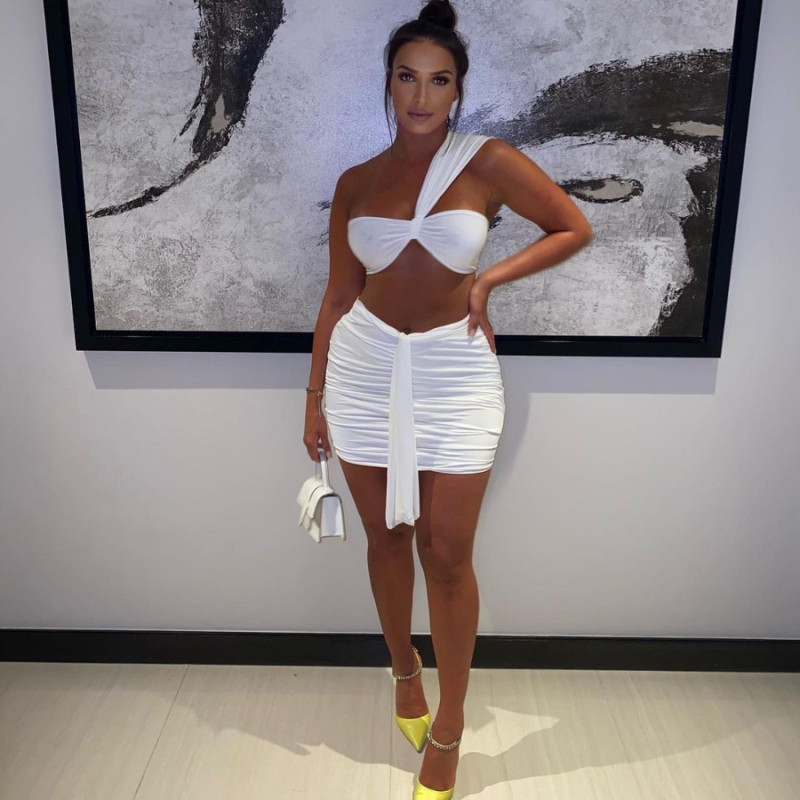 New white sleeveless solid color skirt suit short tube top folds navel two-piece suit JZH8028