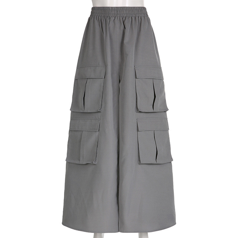 Solid woven high waisted elastic stitching with multiple pockets, loose fit, oversized work style A-line half length skirt